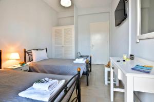 A bed or beds in a room at Kerkyra Apartments