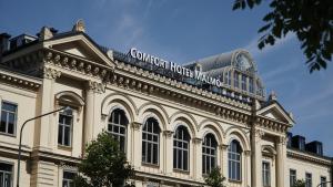 a building with a sign on the top of it at Comfort Hotel Malmö in Malmö