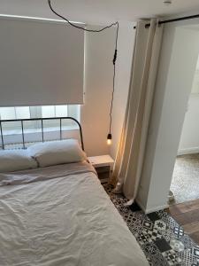 a bedroom with a bed and a window at Kleines, gemütliches Haus in Bonn in Bonn