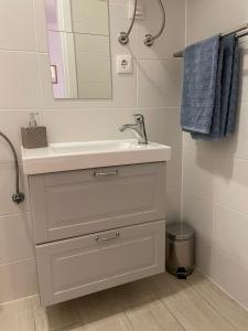 a bathroom with a sink and a mirror at Nine Sveti Juraj in Sveti Juraj +61 photos