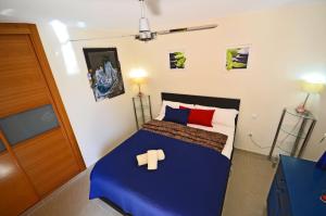 Postel nebo postele na pokoji v ubytování Ferienwohnung PLAYA - Pool - 50 m Strand - Meerblick - WiFi