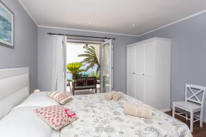 Posteľ alebo postele v izbe v ubytovaní Apartments Villa Mirjana