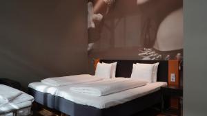 Säng eller sängar i ett rum på Comfort Hotel Malmö