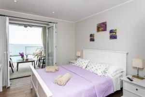 Posteľ alebo postele v izbe v ubytovaní Apartments Villa Mirjana