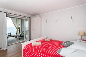 Posteľ alebo postele v izbe v ubytovaní Apartments Villa Mirjana
