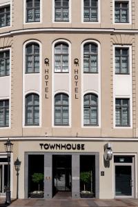 a large tan building with a town house at Townhouse Dresden in Dresden
