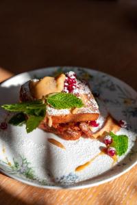 a plate of food with a piece of toast at Townhouse Dresden in Dresden