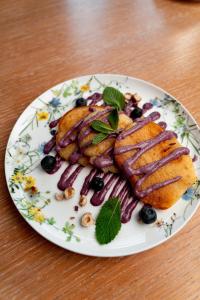 a plate of food on a wooden table at Townhouse Dresden in Dresden
