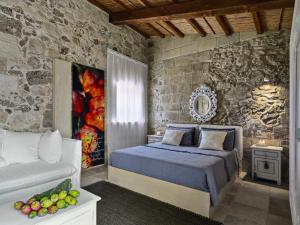 Postel nebo postele na pokoji v ubytování Relais Masseria Capasa