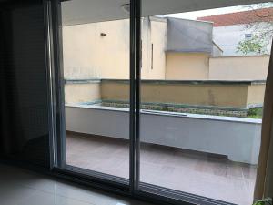 an open window with a view of a balcony at Super appartement 45 m2 proche Paris in Montreuil