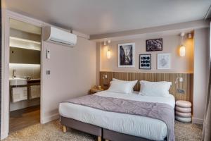 Ein Bett oder Betten in einem Zimmer der Unterkunft Passy Eiffel