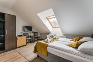 Posteľ alebo postele v izbe v ubytovaní Hotel Smile Pieniny