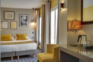 Ein Bett oder Betten in einem Zimmer der Unterkunft Passy Eiffel
