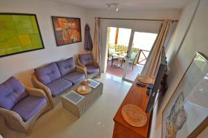 Televízia a/alebo spoločenská miestnosť v ubytovaní Ferienwohnung PLAYA 2 - Pool - Meerblick - 50m Strand - WiFi