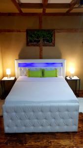 Posteľ alebo postele v izbe v ubytovaní ŠANTI