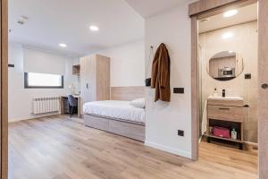 A bed or beds in a room at Micampus Santander Student Residence