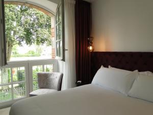 Postel nebo postele na pokoji v ubytování Hôtel Ginkgo - SPA Biloba
