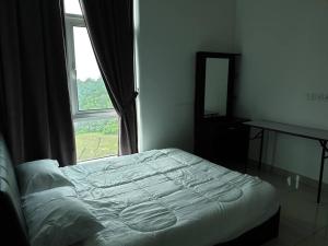 a bed sitting in a bedroom with a window at Direct QBM & IKEA *Highfloor Sunrise Seaview Condo in Bayan Lepas