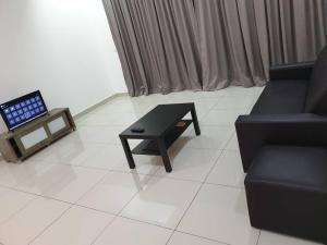 a living room with a couch and a coffee table at Direct QBM & IKEA *Highfloor Sunrise Seaview Condo in Bayan Lepas