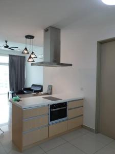 a kitchen with a sink and a stove top oven at Direct QBM & IKEA *Highfloor Sunrise Seaview Condo in Bayan Lepas
