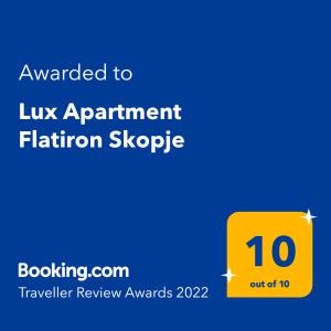 a yellow sign with the text awarded to lux apartment fiction slope at Lux Apartment Flatiron Skopje in Skopje