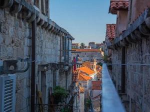 a view of an alley with buildings and roofs at Two Friends Dubrovnik Palace in Dubrovnik