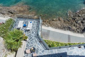 an overhead view of a swimming pool next to the ocean at Castelbrac Hotel & Spa in Dinard