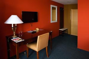 TV a/nebo společenská místnost v ubytování Hotel Rieger Garni