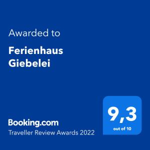 Ett certifikat, pris eller annat dokument som visas upp på Ferienhaus Giebelei