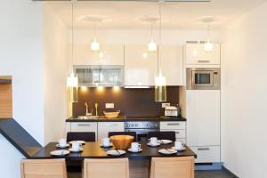 Kuchyň nebo kuchyňský kout v ubytování LEDERER Boutique Hotel