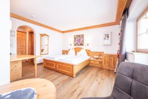 Postel nebo postele na pokoji v ubytování Adults Only Boutique-Hotel Unterlechner