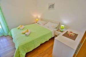 Lova arba lovos apgyvendinimo įstaigoje Apartments Lenka