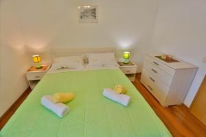 Postel nebo postele na pokoji v ubytování Apartments Lenka