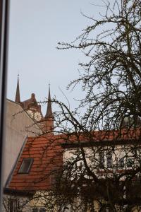 a building with a red tile roof with two towers at Altstadt, Neue Wallstraße in Wismar
