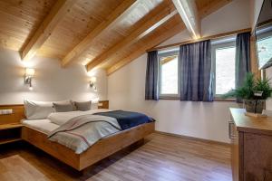 Postel nebo postele na pokoji v ubytování Bergchalet Haflingerherz