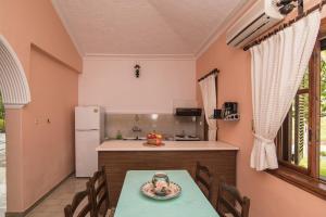 A kitchen or kitchenette at Alykes Park Bungalows