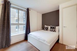 Llit o llits en una habitació de Capital Stay Aldgate - Two bed Apartment