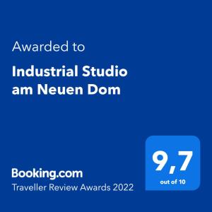 a blue sign with the text awarded to industrial studio am never dorm at Industrial Studio am Neuen Dom in Linz