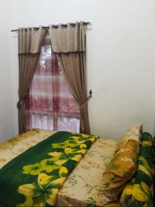 Una cama o camas en una habitación de Villa FID Bandungan