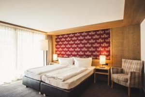 Postel nebo postele na pokoji v ubytování Hotel Hubertus - Au Bregenzerwald