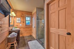 a bathroom with a shower and a sink at Panoramic Mtn Views Luxe Smoky Mountain Cabin! in Waynesville +36 photos