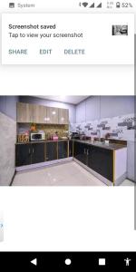 a screenshot of a kitchen with a picture of a counter at Private 2BD Apartment Opposite Dha Phase 8 in Lahore