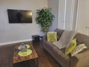 a living room with a couch and a table at Fresh Modern Industrial split level in Cincinnati