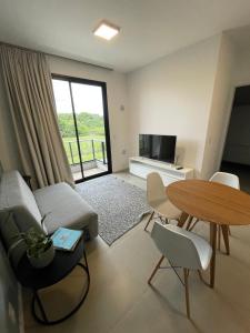 Uma TV ou centro de entretenimento em Village dos Gerânios