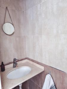 a bathroom with a sink and a mirror at Duplex 571 in Chascomús +20 photos
