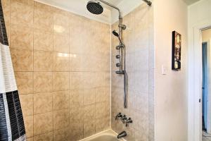 a bathroom with a shower with a tub at House with Pellet Smoker and Grill, 1 Mi to Lake! in Bellmawr +18 photos