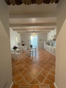 a large kitchen and dining room with a tile floor at B & B La casa dei sogni in Casapulla +22 photos