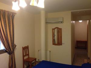 Postel nebo postele na pokoji v ubytování Hostal Delfin Verde