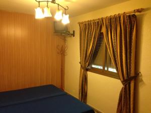 Postel nebo postele na pokoji v ubytování Hostal Delfin Verde