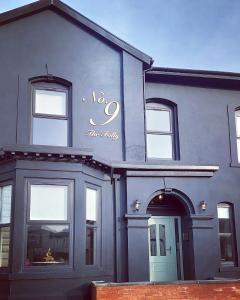 a blue building with a sign on the side of it at No 9 The Folly in Southport